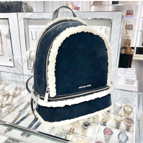 Michael Kors Handbags - Michael Kors black and Cream Backpack is leather/ fur is faux new bag